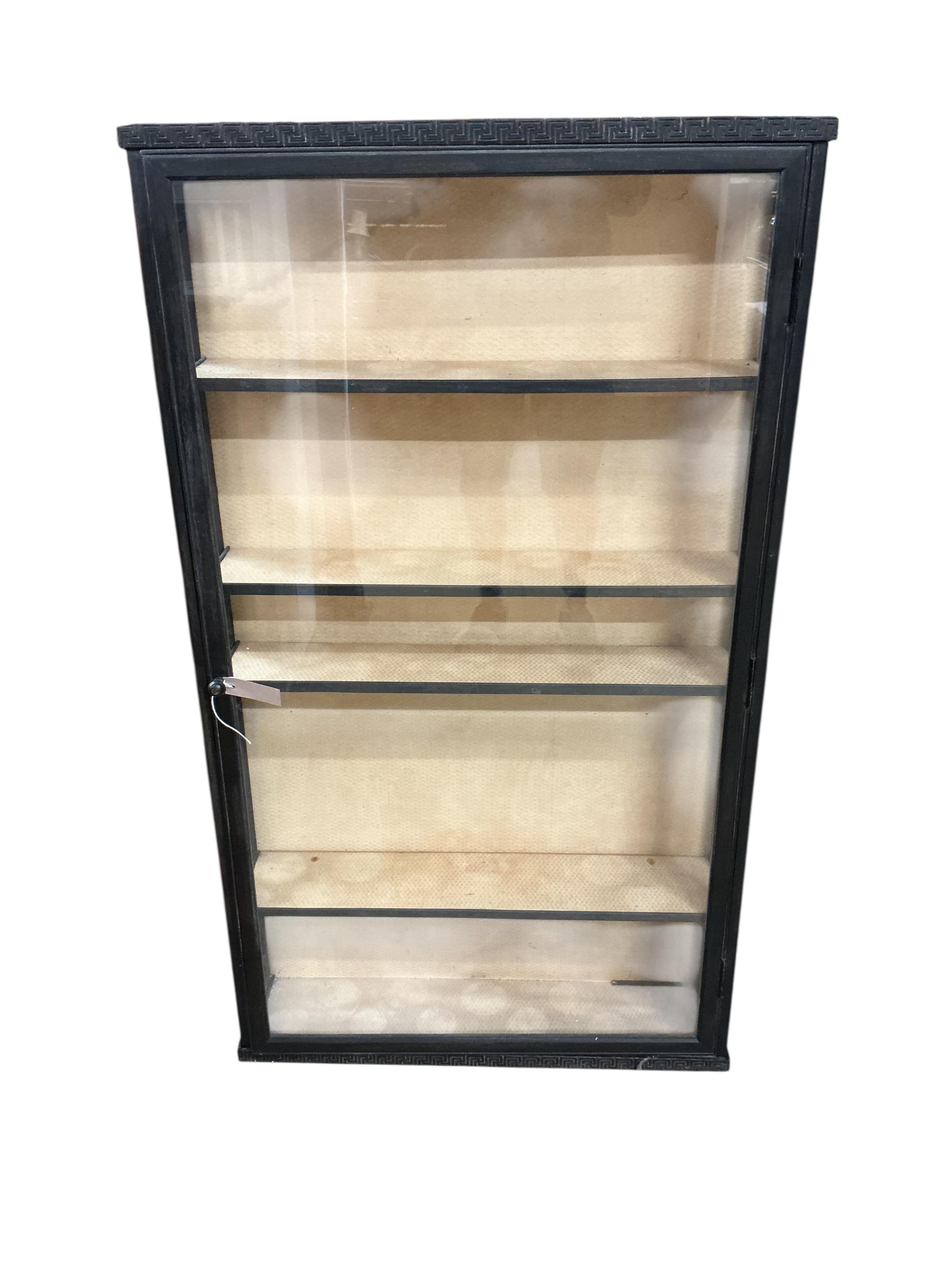 A Regency style ebonised wall cabinet, width 70cm, depth 15cm, height 122cm